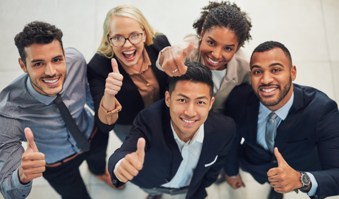 happy employees with thumbs up